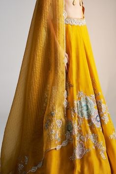 Honey gold tissue silk lehenga with an attached cancan and zardosi, french knots, aari and dori embroidery. Comes with a padded blouse and a dupatta. - Aza Fashions Wedding Choli With Zari Work In Slub Silk, Elegant Slub Silk Lehenga With Sheer Dupatta, Wedding Slub Silk Lehenga For Navratri, Reception Slub Silk Lehenga With Zari Work, Gold Anarkali Lehenga In Slub Silk, Wedding Slub Silk Choli With Cutdana, Wedding Choli With Dupatta In Slub Silk, Yellow Raw Silk Dress For Reception, Designer Wear Floor-length Slub Silk Lehenga