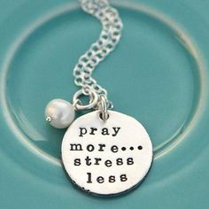 This hand-sculpted fine pewter pendant necklace is inscribed with the words "Pray More, Stress Less". May this uplifting necklace serve as a peaceful reminder to bring your worries to Christ and leave the stress behind. The pendant is sweetly accented with a freshwater pearl. Pendant Diameter: 7/8"  Coordinating Chain: Spiritual Hand Stamped Pendant Necklace, Everyday Spiritual Nickel-free Charm Necklaces, Inspirational Adjustable Nickel-free Charm Necklaces, Adjustable Inspirational Nickel-free Charm Necklace, Nickel-free Spiritual Charm Necklaces For Everyday, Everyday Inspirational Hand Stamped Necklaces, Inspirational Hand Stamped Everyday Necklace, Everyday Inspirational Hand Stamped Necklace, Inspirational Silver Adjustable Necklace