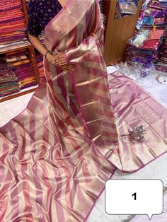 **Pure Dual Tone Tissue Silk Saree with Blouse Piece** Step into elegance with our Pure Dual Tone Tissue Silk Saree, a luxurious piece that radiates sophistication and timeless beauty. Perfect for festive occasions and special events, this handloom masterpiece is designed to make you feel like royalty. **Features - **Exquisite Craftsmanship Handloomed with precision, this saree showcases the impeccable skills of our artisans, ensuring a high-quality weave that's both durable and elegant. - **Dua Traditional Tissue Silk Wear With Zari Weaving For Party, Pink Tissue Silk Saree For Celebration, Pink Tissue Silk Sets For Celebration, Pink Tissue Silk Blouse Piece With Zari Weaving, Multicolor Banarasi Silk Blouse Piece For Party, Party Saree With Zari Weaving In Multicolor, Pink Dola Silk Blouse Piece For Celebration, Pink Dola Silk Blouse For Celebration, Party Saree With Multicolor Zari Weaving