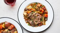 three plates of food on a white table