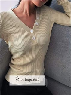 Sun-imperial Beige V Neck Ribbed Jumper with Button detail Deep V Neck Rib Knit top High Street Fashion Beige Ribbed V-neck Top, V-neck Top With Buttons For Fall, Trendy V-neck Top With Buttons, V-neck Top With Button Closure For Fall, Trendy Winter Tops With Buttons, Trendy Beige Tops With Button Closure, Trendy Buttoned Knit Top For Spring, Trendy Knit Top With Buttons For Spring, Fitted Knit Tops With Buttons