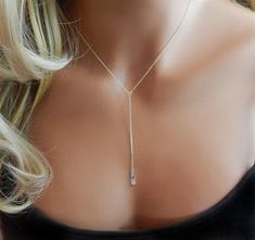 Lariat Cubic Zirconia Y Necklace Add a Touch of Sparkle to your outfit with this super cute, radiant, delicate clear cubic zirconia necklace. This cz pendant is complete with a high polished, 14K Gold Filled, Rose Gold Filled or Sterling Silver Chain. Great everyday look! ■ Click + More for more Necklace For Low Cut Dress, Y Necklace Silver, Delicate Drop Necklace With Adjustable Chain For Parties, Formal Backdrop Necklace With Clavicle Chain, Party Lariat Necklace With Dangle And Adjustable Length, Silver Minimalist Drop Necklace For Party, Silver Y-shape Lariat Necklace For Party, Sterling Silver Lariat Necklace For Party, Sterling Silver Clavicle Chain Lariat Necklace For Parties