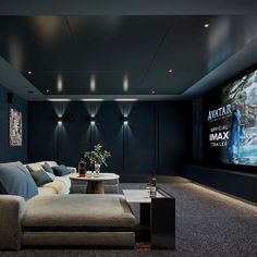 a living room with couches and a large screen