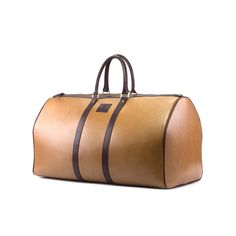 Heavy hardware and durable leather straps make our Duffle Bag durable and suitable for all your travel... whether on vacation or simply heading to the office. Designed to be as spacious and long-lasting as you need. THE DETAILS: Materials: Full grain mustard Italian leather + black box calf Italian leather Lining: Dark Brown Fabric Dimensions: 24 x 12.6 × 11.4 inches / 61 × 32 × 29 cm (width × height × depth) THE FINE PRINT: Production timeline/shipping can vary from 40-50 days from the date of Classic Leather Rectangular Travel Accessories, Classic Travel Accessories With Leather Handles For Daily Use, Classic Travel Luggage With Leather Backing, Cognac Leather Handle Bags For Business Trips, Cognac Bag With Leather Handles For Business Trips, Classic Brown Travel Accessories With Leather Handles, Cognac Leather-handled Bag For Business Trips, Elegant Cognac Duffle Bag For Travel, Brown Leather Travel Accessories With Leather Handles