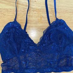 Perfect Condition! New Without Tags. Never Worn. This Bra Is Labeled As A Large But It Definetly Is Not. Not Sure If Labeled Wrong But I Never Was Able To Return It. This Would Fit An A-B Cup And Is Super Sexy And Adjustable. Fitted Blue Bra With Lace Closure, Blue Lace Trim Bra For Spring, Blue Lace Trim Bra For Summer, Womens Abs, Black Sheer Top, Black Lace Bralette, Black Lace Bra, Black Swimwear, Plunge Bra