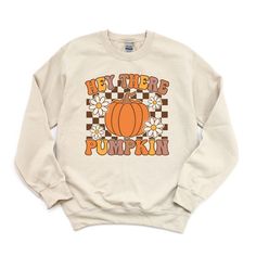 Looking for a cute versatile top to wear this summer? Make sure to grab one of our Hey There Pumpkin Flowers Sweatshirts! This soft and comfortable shirt is the perfect top for any outfit. It can be paired with biker shorts, Jeans, or the classic stay at home sweats! The bright color adds a pop of summer to any outfit. This sweatshirt is true-to-size, so be sure to order your regular size! If you are looking for a more oversized look, make sure to size up. Fall Slogan Tops For Leisure, Slogan Tops For Leisure In Fall, Retro Soft-washed Sweatshirt For Fall, Fall Graphic Tee Sweatshirt With Funny Print, Retro Everyday Fall Tops, Everyday Retro Fall Tops, Retro Everyday Tops For Fall, Casual Cotton Sweatshirt With Funny Print, Retro Slogan T-shirt For Fall