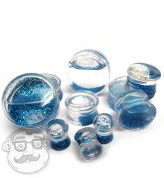 blue and white glass beads with silver flecks on the bottom, sitting next to each other