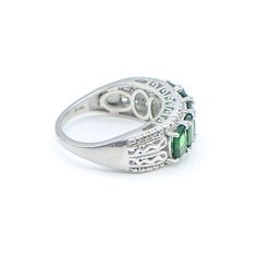 Sterling Silver Chrome Diopside Half Eternity Band Ring Size 8 With Diamonds. This Platinum Plated Sterling Silver Half Eternity Band has all the details you can ask for. Five gorgeous oval cut Green Chrome Diopside gemstones accented by four small round cut White Diamonds for extra sparkle. The ring features beautiful scrollwork detailing along the band as well as on the designer side panel. Complete with a comfort fit design, which allows the ring to slide on smoothly and it is more comfortabl Classic Green Multi-stone Emerald Ring, Oval Tsavorite Ring With Gemstone Accents, Oval Green Emerald Ring With Gemstone Accents, Oval Multi-stone Tsavorite Rings, Oval Tsavorite Multi-stone Ring, Oval Multi-stone Emerald Ring, Classic Green Multi-stone Sapphire Ring, Oval Green Sapphire Ring For Anniversary, Green Oval Sapphire Ring For Anniversary