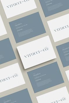 several business cards are arranged on top of each other, with the words virtuccio in blue and white