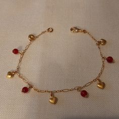 The Bracelet Is Made Of A Gold Filled Chain And Mini Hearts With Ruby Beads. The Closure Is A Lobster Clasp. It Is A Size 7. There Are 3 Bracelets Which Are Sold Separately. New, Never Used. In Pristine Condition. Elegant Beaded Charm Bracelet For Valentine's Day, Valentine's Day Elegant Beaded Charm Bracelet, Gold Heart Beads Bracelet For Party, Gold Beaded Bracelets With Heart Beads For Party, Gold Party Beaded Bracelets With Heart Beads, Elegant Beaded Heart Charm Bracelet, Elegant Heart-shaped Beaded Charm Bracelet, Elegant Beaded Heart Bracelet For Parties, Party Heart Shape Charm Bracelet With Heart Beads