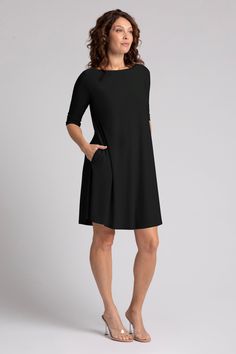 Knit Dress - This timeless dress features a fit and flare silhouette with an elegant high neckline, elbow length sleeves and a swingy hem that falls just above the knee.