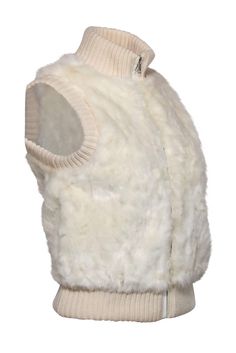 Go soft and chic the sustainable way with this Joie vest! Made with luxe faux fur and ribbed trim made of plush Merino wool, this layering beauty is a perfect addition to your winter whites collection. Throw on over a sleek turtleneck and your favorite jeans and you'll be ready to take on those snowy days in style! Size XS Shell: 100% Acrylic Trim: 100% Merino Wool Lining: 96% Polyester, 4% Spandex Front zip-up closure Lined High neckline Sleeveless Open pockets on sides of waist Ribbed trim Bus Fitted Solid Vest For Winter, Fitted Sweater Vest For Winter Layering, Chic Fitted Sweater Vest For Winter, Chic Winter Vest For Layering, Fitted Faux Fur Vest With Faux Fur Lining, Cozy Winter Vest For Cold Weather, Fitted Vest For Winter Layering, Fitted Winter Vest With Faux Fur Trim, Chic Sleeveless Outerwear With Faux Fur Trim