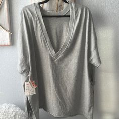 Fp Movement Xs Size Is Oversized In Heather Gray With Pocket Sides . You Can Wear It Two Ways Front Or Back. Gray Relaxed Fit Top For Lounging, Relaxed Gray Top For Spring, Relaxed Gray Tops For Spring, Cotton V-neck Tops For Lounging, Trendy Lounging Tops, Oversized Gray V-neck Top, Oversized Summer Tops For Lounging, Oversized Tops For Summer Lounging, Gray V-neck Top For Loungewear