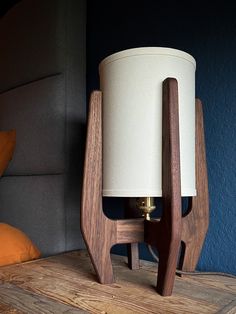 a wooden table with a lamp on it