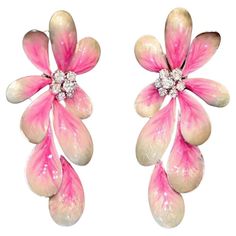 Introducing the charming DAISY FLOWER PINK EARRINGS, a delightful addition to any jewelry collection. Crafted with white gold, these earrings feature enchanting daisy flower motifs adorned with round brilliant cut diamonds, delicately set amidst pink and white enamel petals. Key Specifications: Weight: These earrings weigh a total of 28.95 grams, providing a substantial yet comfortable feel when worn. Net Metals grams: Crafted with 28.69 grams of premium white gold, ensuring durability and lasting beauty. Diamond and Brilliant: Embellished with 1.30 carats of sparkling round brilliant cut diamonds, adding a touch of brilliance and sophistication to the design. These earrings are a whimsical and feminine accessory, perfect for adding a touch of elegance to any ensemble. The combination of d Dope Tattoos For Women, Flower Motifs, Jewelry Flower, Dope Tattoos, Pink Earrings, White Enamel, Daisy Flower, Round Brilliant Cut Diamond, Pink And White