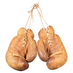 an old pair of boxing gloves hanging on a string