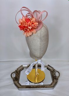 100% Sinamay straw peach and orange fascinator hat adorned with beautiful arrangement of flowers, and sinamay loops. This mini peach orange fascinator would look great with a summer tea party dress. It can be worn to a wedding as wedding guest headpiece or for mother of the bride headpiece or mother of the groom hair accessory. Imagine wearing this gorgeous orange mini hat as your Kentucky Derby hat.   Diameter of peach fascinator / coral fascinator/ orange fascinator hair accessory = 5 inches or 12.5 cm Wear this peach and orange flower  fascinator as any special occasion fascinator, special occasion hat, wedding fascinator, bridal shower fascinator, tea party fascinator, Church fascinator, Kentucky Derby fascinator, Royal Ascot fascinator, Queen's Plate fascinator, race day hat or fashio Spring Ceremony Headband Fascinator, Orange Fascinator For Spring Races, Spring Flower Fascinator For Formal Occasions, Orange Spring Fascinator For Races, Flower-shaped Fascinator With Handmade Flowers For Garden Party, Handmade Flower Fascinator For Garden Party, Handmade Flower Shape Fascinator For Garden Party, Formal Spring Headpiece With Handmade Flowers, Spring Ceremony Headpieces With Headband Shape