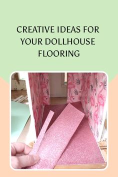 the inside of a dollhouse with pink flooring and curtains on it, in front of