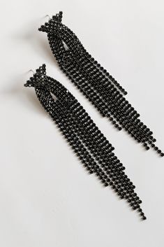 The Dakota Black Rhinestone Fringe Earrings will add some extra sparkle to any occasion! These trendy earrings start with a stud post back and fall to rhinestone fringe chains. Add these fun earrings to a black dress + heels to add a chic touch to your date night look! Gold Plated Rhinestones Fringe Stud Post Back One Size | Length 4” Elegant Rhinestone Fringe Chandelier Earrings For Evening, Elegant Chandelier Earrings With Rhinestone Fringe For Evening, Rhinestone Dangle Chandelier Earrings For Party, Party Dangle Crystal Earrings With Rhinestone Fringe, Evening Rhinestone Dangle Chandelier Earrings, Party Rhinestone Dangle Chandelier Earrings, Elegant Rhinestone Dangle Chandelier Earrings For Evening, Evening Dangle Chandelier Earrings With Rhinestones, Glamorous Party Crystal Earrings With Rhinestone Fringe