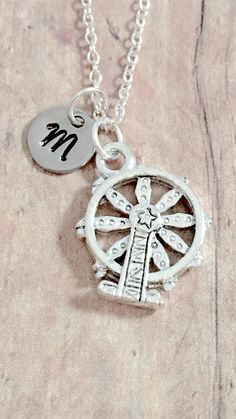 "This listing is for a hand-stamped initial necklace featuring a 3/5\" x 1/2\" silver plated pewter Ferris wheel charm & 3/10\" stainless steel initial pendant. The silver plated chain is 18\" long, but can be made to your desired length- see last photo in listing. Please indicate the chain length you would like in the 'notes to seller' section at checkout. All items are lead & nickel free. Message me with any questions, thank you! Add an initial to any necklace https://www.etsy.com/list Personalized Themed Sterling Silver Jewelry, Themed Personalized Charm Necklaces, Personalized Silver Charm Necklace, Silver Vintage Charm Initial Pendant Jewelry, Silver Vintage Charm Jewelry With Initial Pendant, Silver Jewelry With Vintage Charm Initial Pendant, Adjustable Themed Silver Charm Necklaces, Themed Adjustable Silver Charm Necklaces, Adjustable Silver Themed Charm Necklaces