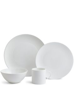 a white dinner set with two cups and one plate