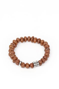 Featuring a natural finish, a collection of faux brown stones are threaded along a stretchy band around the wrist. Shimmery silver accents are added to the earthy compilation for an artisan inspired finish. Sold as one individual bracelet. Brown Bracelet, Silver Frames, Unisex Bracelets, Band Bracelet, Paparazzi Accessories, Stretchy Bracelets, White Rhinestone, Chic Jewelry, Paparazzi Jewelry