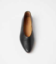 Slip into comfort and style with these versatile black leather ballet flats! Featuring a pointed toe design, these flats are perfect for any occasion. Dress them up or down, these flats are sure to be a staple in your wardrobe. True to size Material: Leather Heel height: 0.25" Imported Seychelles Wipe with soft cloth | Karen Kane Pointed Toe Ballet Flats in Black, Size 9.5, Plain Branded Insole Ballet Flats For Workwear, Medium Width Ballet Flats For Workwear, Workwear Almond Toe Ballet Flats With Rubber Sole, Workwear Ballet Flats With Medium Width, Medium Width Ballet Flats For Work, Workwear Ballet Flats With Branded Insole, Sleek Business Ballet Flats With Round Toe, Pointed Toe Slip-on Flats For Business, Low Heel Ballet Flats With Leather Sole For Work