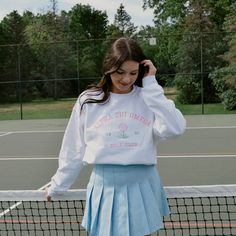 Tee off in style with this preppy crew! This crew is perfect for spilling the tea in with your girls or practicing your swing in on a summer night. Pair with your favorite golf skirt or cheer skirt for a cute summer outfit. This crew will have your sorority name embroidered in pink thread above your established year and a cute golf ball on the tee. Model is wearing a size large White crew with bright pink and green embroidery Cotton Tennis Skirt For Spring, Casual Cotton Tennis Skirt For Cheerleading, White Preppy Tennis Skirt For School, Southern Preppy Outfits, Sorority Names, Cute Summer Outfit, Pink Thread, Green Embroidery, Golf Skirt