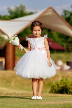 "This dress is made for a special occasion, like a wedding or a birthday party. The satin bodice is combined with beautiful lace and elegant back on the buttons. The dress is accompanied by a sash, that can be tied either in the back, or in the front. The multi-layer tulle and a layer of shiny tulle the  look extremely light and flawless, and the high quality cotton lining will add more comfort to your girl, even when wearing it for many hours.  We guarantee that you will be 100% happy with the quality of the product, as we create our dresses with lots of love and attention.  Each dress that we create is absolutely unique and one of a kind. Size: Please do the needed measurements before making the order. You may find the size chart on the last 2 pictures of the listing. It may may help you Elegant Tulle Princess Dress For Garden Party, White Princess Dress With Floral Applique For First Communion, White Princess Dress With Tulle Skirt For Bridesmaid, Tulle Princess Dress With Floral Applique For First Communion, White Spring Princess Dress For Bridesmaid, Princess Style White Tutu Dress With Floral Applique, Princess White Fairy Wedding Dress, Elegant Bridesmaid Princess Dress With Floral Applique, Tulle Princess Dress For Garden Party