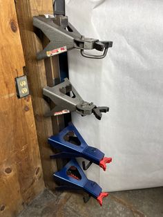 there are three different types of clamps on the side of a door, and one is blue