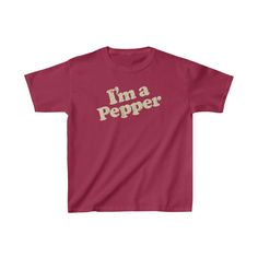 I’m a Pepper 1977 Vintage Kid's T-Shirt Description The “Be a Pepper” campaign began in 1977 continued until about 1983 and anybody that was old enough during those years knows the jingle which went “I’m a Pepper, he’s a Pepper, she’s a Pepper, we’re a Pepper, wouldn’t you like to be a Pepper, too?” by heart. It was a catchy tune that caused you to hum or sing along and even resulted in clothing and accessories featuring “I’m a Pepper.” By 1980, “Be a Pepper” was ranked as the third most popular Pop Culture Short Sleeve T-shirt With Logo, Retro Red T-shirt With Screen Print, Vintage Short Sleeve T-shirt With Text Print, Retro Cotton Slogan Shirt, Retro Red T-shirt With Text Print, Retro Red T-shirt With Logo Print, Retro Crew Neck T-shirt With Text Print, Retro Cotton T-shirt With Logo Print, Retro Red Pre-shrunk T-shirt