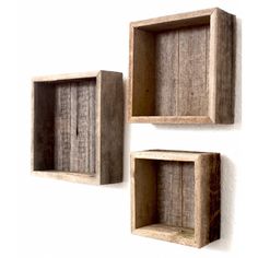 two wooden shelves mounted to the side of a wall