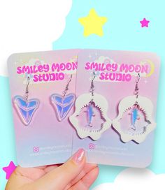 Thank you for shopping small at Smiley Moon! All items are handmade in-house by me. :')  Read below for some more info- I appreciate you!! All earring findings are stainless steel. Each earring is laser cut and hand-painted with love in small batches or are made-to-order, so please allow for slight variations. THANK YOU FOR SHOPPING SMALL! ❤  Acrylic may have slight imperfections due to the nature of the laser and material used. Color variations may differ based on the settings and viewing abilities of your device. If the design has a printed pattern, pattern may vary slightly.  Please visit the FAQ page on my website, smileymoonstudio.com for important information regarding taking care of your jewelry, shipping, etc. Please reach out if you have any questions! I will answer ASAP :) I appr Acrylic Earrings Laser Cut, Laser Cut Jewelry Acrylic, Acrylic Laser Cut, Shark Earrings, Color Palette Yellow, Laser Cut Jewelry, Kawaii Accessories, Altering Clothes, Backing Card