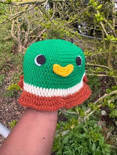 This Mallard Duck hat is the perfect spring/summer accessory.  Available in sizes newborn to adult XL (Model is wearing size Size 3-5 years) Made from 100% acrylic yarn (As each hat is handmade, there may be a small variance in the size/ colour of the product) This piece is made to order. It will take 1-2 weeks for your order to be hand crafted (with love) and then shipped.   Custom colours are available upon request. Send an email to danae.handmade@googlemail.com with your choice of colours, an Cute Crochet Hat With Curved Brim, Cute Green Hat With Curved Brim, Crochet One Size Fits Most Bucket Hat, Cute One Size Fits Most Brimmed Crochet Hat, One Size Crochet Mini Hat With Curved Brim, Green Yarn Hat With Short Brim, Green Knitted Hat For Spring, One Size Curved Brim Crochet Mini Hat, Green Crochet Hat In Acrylic Yarn