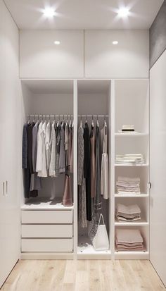 a white closet filled with lots of clothes and shoes on top of wooden flooring