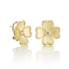 Heralding the arrival of spring, dogwood blossoms are faithfully re-created in 18-karat yellow gold and finished with a diamond pastil. Since 1861, Gump's has been a destination for jewelry that is distinctive and timeless. Featuring only the finest materials, each piece is a statement of elegance. Diamonds, 0.15ctw. 18-karat yellow gold. Pierced or clip. 5/8" long. Wedding Flower Earrings In 14k Yellow Gold, Luxury Brilliant Cut Flower Earrings For Anniversary, 14k Yellow Gold Flower Earrings For Anniversary, Classic Flower Shaped Jewelry With Single Cut Diamonds, Classic Flower-shaped Jewelry With Single Cut Diamonds, Luxury Diamond Flower Earrings, Luxury Diamond Flower Earrings For Gift, Luxury Gold Flower Earrings For Anniversary, Classic Gold Diamond Flower-shaped Earrings