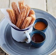 churros and dipping sauce on a plate