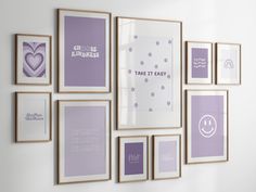 there are many frames on the wall with purple and white pictures above them that say it's time to easy