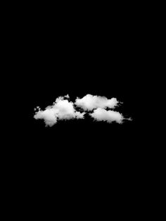 three white clouds floating in the sky on a black background with only one cloud visible