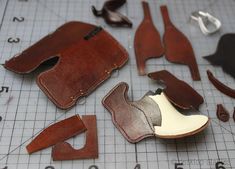 several pieces of leather laid out on a table