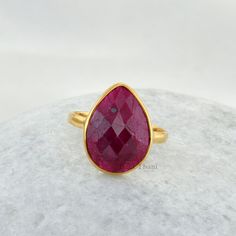 Ruby Beautiful Pear 10x14mm Micron Gold Plated 925 Sterling Silver Ring For Women Item Code: BTJW2155 Metal: 925 Sterling Silver Plating : Micron Gold Plated Stone Detail:Ruby, Pear, 10mm x 14mm * Please note that there will be slight variations in stone texture and color shades in the actual product that you receive. Stone quality or grade will be same. * All our jewelry is Micron Plated which is higher quality as compared to Standard Plating NOTE: All our Rose Gold and Gold Jewelry is Micron P Classic Teardrop Ruby Ring For Gift, Jewelry For Teens, New Mom Jewelry, Silver Ring For Women, Mom Jewelry, Stone Texture, Jewelry Show, Handcrafted Rings, Ruby Ring