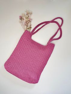 Here's something that is sure to get your attention! Our gorgeous pink shopper bag made on crochet is the perfect addition to your closet. It was handmade and is very practical. It will hold everything you need during the day. Its dimensions are 24 cm wide, 28 cm high, and the handle is 23 cm long. This beautiful handbag adds charm to any styling, and is perfect for any occasion. Don't delay and add it to your collection today! Pink Shoulder Bag With Braided Handles For Daily Use, Pink Rectangular Shoulder Bag With Braided Handles, Pink Rectangular Straw Bag With Adjustable Strap, Pink Straw Tote Bag With Adjustable Strap, Pink Straw Bag With Adjustable Strap For Shopping, Trendy Pink Straw Shoulder Bag, Casual Pink Rectangular Straw Bag, Pink Rectangular Straw Bag For Daily Use, Rectangular Pink Straw Bag For Daily Use