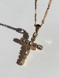 Introducing the exquisite Hope CZ Cross Necklace - a timeless symbol of faith and style. This stunning piece features a 60mm 24k gold-filled CZ Cross, being a statement piece for all wearers. The Hope CZ Cross Necklace comes in 2 chain options - our Baldwin CZ Necklace and our Luxe Curb Chain. This necklace is a must in your jewelry collection for all trendy and aesthetic wearers. Product Details 2 Chain Options 18" 3mm 24k Gold-Filled Baldwin CZ Necklace 16" 4mm 18k Gold-Filled Curb Chain 60mm 24k Gold-Filled CZ Cross Charm CZ should not be worn in water Made in Scottsdale, AZ Cute Furniture, Timeless Symbol, Cz Necklace, Solid Gold Jewelry, The Hope, Scottsdale Az, Cross Charms, Gold Filled Jewelry, Curb Chain