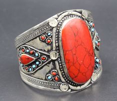 I am offering Afghan Turkmen alpaka cuff bracelet. Its %100 hand crafted workmanship with beautiful compressed Coral enamel stone and lovely design. Please do not hesitate to contact if you have any questions. Weight : 56.5 grams, Inner circumference : 15cm ( 5.9" ) Width : 6.5cm ( 2.6" ) Shipping & Estimated Delivery Time With Turkish Registered Post, Destination CountryStandard Shipping (business days) United States          15-20  Europe7-15 Asia15-25  Australia15-20 Brazil & South America Boho Cuff Bracelet, Boho Cuff, Coral Stone, Bracelet Boho, Style Boho, Boho Bracelets, Red Coral, Boho Style, Cuff Bracelet