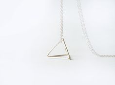 This edgy minimalist necklace has a hand forged sterling silver pyramid pendant, made of joined triangles, hanging from a sterling silver chain. This Minimalist Silver Pyramid Jewelry, Minimalist Silver Triangle Necklace, Silver Triangle Jewelry For Everyday, Minimalist Sterling Silver Triangle Necklace, Minimalist Geometric Sterling Silver Necklace, Edgy Minimalist, Pyramid Necklace, Pendant Necklace Long, Necklace Minimalist Jewelry