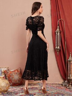 This chic and elegant dress features flounce sleeves, a feminine ruffle hem, and delicate lace details. Perfect for any occasion, this dress exudes sophistication and grace. The flounce sleeves add a touch of whimsy and the ruffle hem adds an eye-catching element. Color : Black Style : Elegant Details : Ruffle Hem, Eyelet Embroidery Type : A Line Pattern Type : Plain Sleeve Length : Short Sleeve Neckline : Scoop Neck Sleeve Type : Flounce Sleeve Hem Shaped : Flared Length : Long Fit Type : Regular Fit Fabric : Slight Stretch Material : Fabric Composition : 90% Polyamide, 10% Elastane Care Instructions : Hand wash,do not dry clean Body : Lined Sheer : Semi-Sheer Lining : 89% Polyester, 11% Elastane Size US Bicep Length Bust Cuff Hip Size Length Shoulder Sleeve Length Waist Size XS 2 16.9 34 Evening V-neck Lace Dress With Ruffles, Elegant Dresses With Lace Bell Sleeves, Elegant Dresses With Ruffle Hem And Flutter Sleeves, Elegant Lace Dresses With Lace Cuffs, Fitted Dress With Lace Bell Sleeves, Elegant Summer Lace Dress With Lace Cuffs, Lace Midi Dress With Lace Trim For Evening, Formal Feminine Lace Dress With Ruffles, Feminine Party Dresses With Lace Cuffs