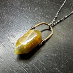 I recently sourced some beautiful crystals and stones so that we could make some more unique Taliswoman necklaces!This listing is for a lovely Yellow Opal, measuring 1 1/8" tall and suspended from a brass bail with a 20"/22" adjustable Sterling Silver chain. The total length from the bottom of the Opal to the top of the brass bail is 1 3/4". Yellow Opal has the same properties as any other Opal but it also carries additional properties associated with its color. It is said to have an uplifting and revitalizing effect, however, if you are already feeling down this is not a good stone for you as it can amplify emotions which is fantastic when you're up and motivated, but not much fun if you are feeling blue! It brings within it emotional stability and helps to reinforce positive thought patt Mod Earrings, Popular Necklaces, Popular Earrings, Positive Thought, Emotional Stability, Jewellery Showroom, Beautiful Crystals, Yellow Opal, Wholesale Gifts