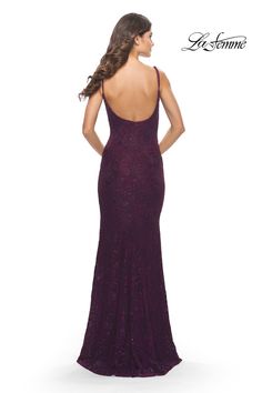 a woman in a long purple dress with an open back and straps on the side