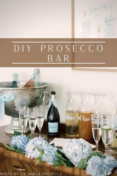 a wooden table topped with lots of glasses and bottles