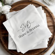 four personalized napkins on a plate with flowers